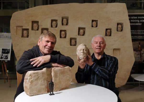 Former miners Stephen Hamilton who worked at Cadeby Main colliery and Keith Marshall who worked at Brodsworth colliery with a  mock-up of the proposed sculpture design dedicated to miners in the centre iof Doncaster. Picture Tony Johnson.