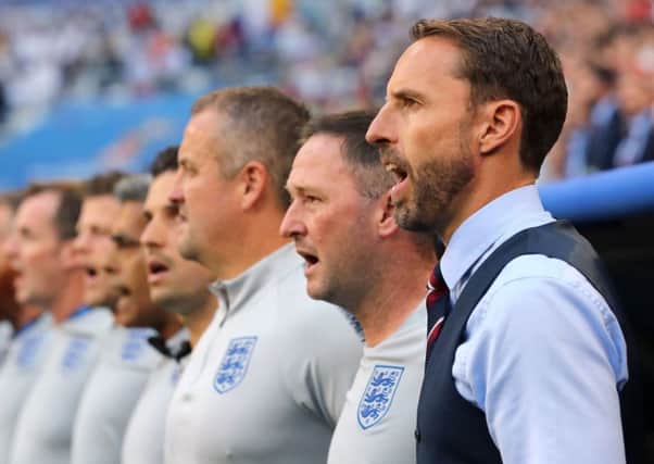 England manager Gareth Southgate (right) and backroom staff sing the national anthem before the FIFA World Cup, Quarter Final match at the Samara Stadium. But is it time we had a new national anthem?  (PA).