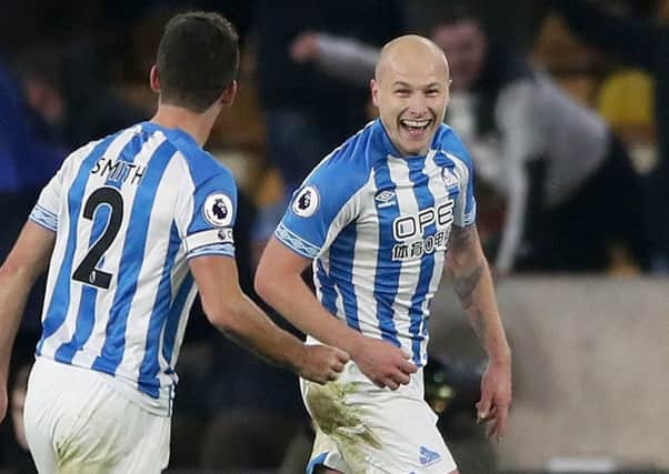 Huddersfield Town's Aaron Mooy (right) celebrates scoring his side's second goal at Wolves.