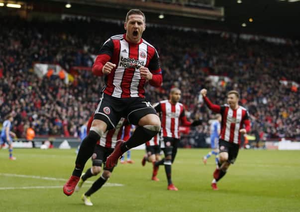 Double: Billy Sharp celebrates his second goal during the Championship match against Leeds at Bramall Lane. Picture: Jack Lancelott/Sportimage