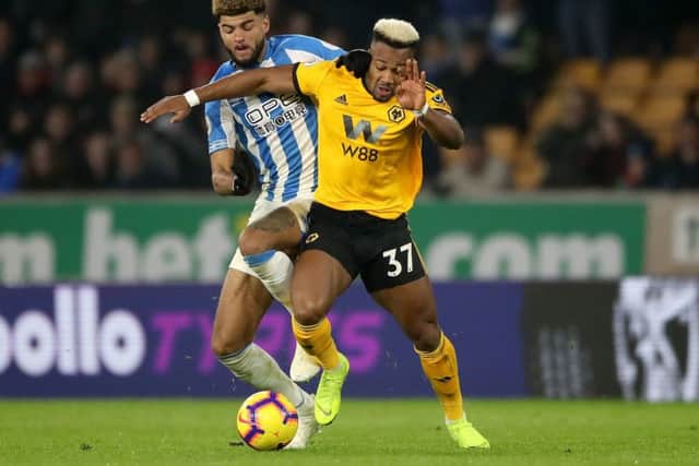 Huddersfield Town's Philip Billing (left) and Wolverhampton Wanderers' Adama Traore battle for the ball during the Premier League match at Molineux, Wolverhampton. (Picture: Nick Potts/PA Wire)