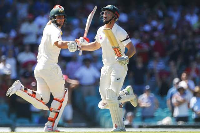 Australia's Shaun Marsh celebrates his century during day four of the Ashes Test match at Sydney. Picture: Jason O'Brien/PA