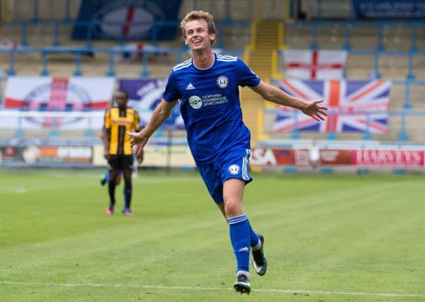 King for a day: FC Halifax Town midfielder Cameron King celebrates his goal against Morecambe in the first round of the FA Cup