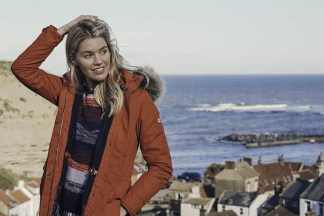 Model wears Barbour Stronsay waterproof jacket, Â£229, and Rossili knit. All at Barbour.com.