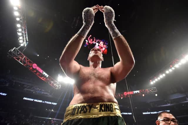 Salute: Tyson Fury applauds the big British contingent in Los Angeles.