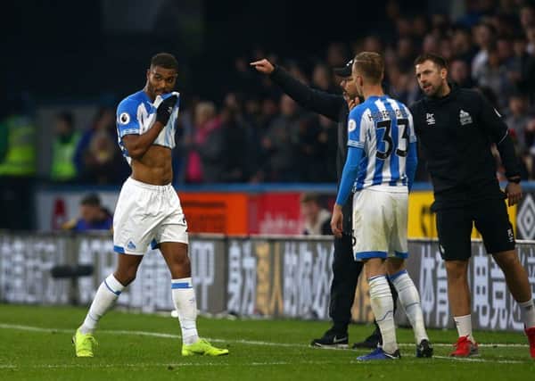 Huddersfield Town's Steve Mounie leaves the pitch after being shown a red card on Saturday. Picture: Dave Thompson/PA
