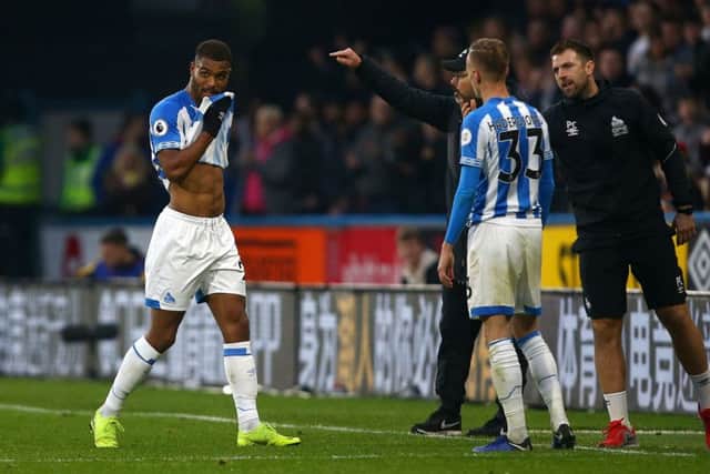 Huddersfield Town's Steve Mounie leaves the pitch after being shown a red card. Picture: Dave Thompson/PA