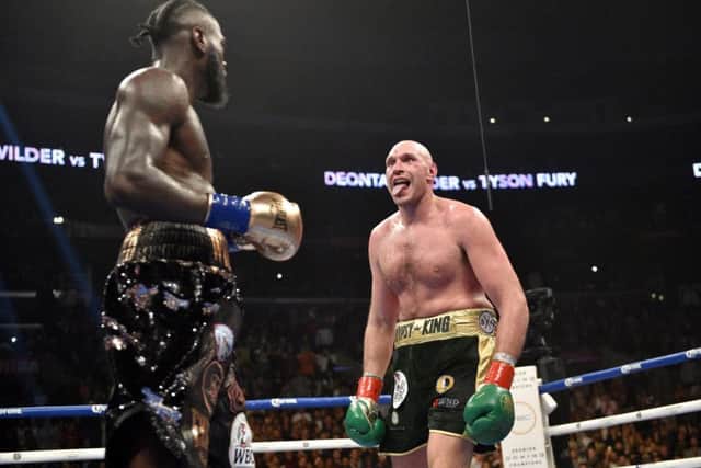 Deontay Wilder and Tyson Fury during the WBC Heavyweight Championship bout at the Staples Center in Los Angeles. (Picture: Lionel Hahn/PA Wire)