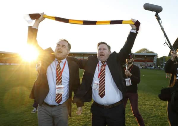 Bradford co-owners Edin Rahic (left) and Stefan Rupp celebrate after winning the League One play-off semi-final at Fleetwood Town. Picture: Martin Rickett/PA