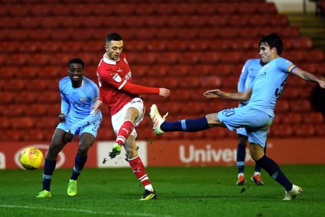 GET IN: Barnsley's Jordan Williams scores his side's second goal.
 Picture: Jonathan Gawthorpe