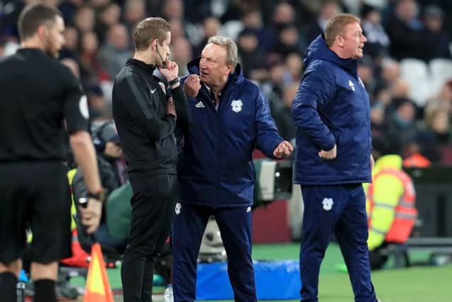 FRUSTRATION: Cardiff City manager Neil Warnock (centre) speaks to fourth official John Brooks at the London Stadium. Picture: Mike Egerton/PA