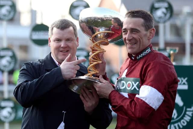 Winning jockey Davy Russell and trainer Gordon Elliott (left) after winning the Grand National with Tiger Roll at Aintree in April. Picture: David Davies/PA Wire