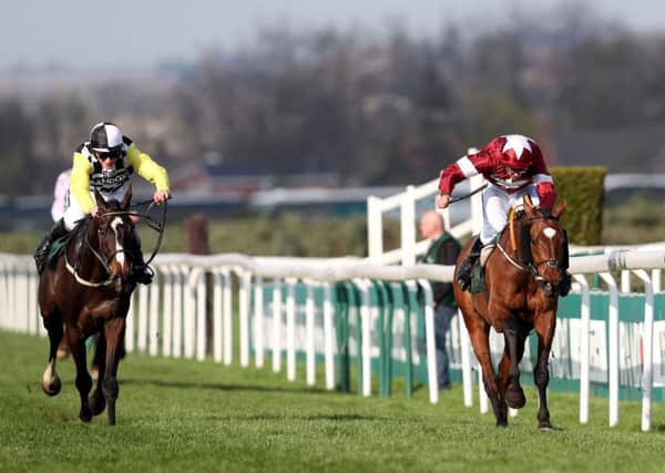 Tiger Roll and jockey Davy Russell (right) win the Grand National from Pleasant Company and jockey David Mullins at Aintree. Picture: David Davies/PA