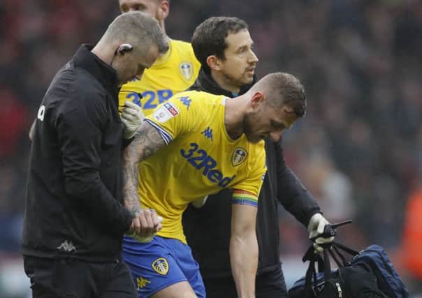 Liam Cooper of Leeds United goes off injured against Sheffield. United (Picture: Simon Bellis/Sportimage)
