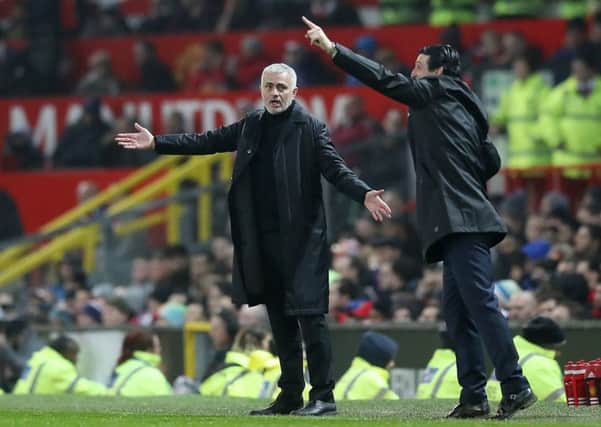 Manchester United manager Jose Mourinho (left) and Arsenal manager Unai Emery gesture on the touchline during the Premier League match at Old Trafford, Manchester. (Pictures: PA)