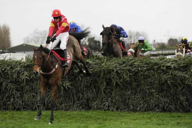 Highland Lodge and Henry Brooke clear the last in the 2015 Becher Chase.