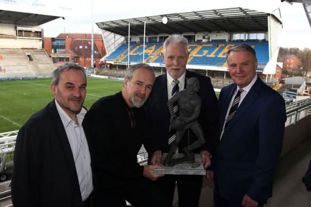 John Holmes' brother Phil Holmes shows of the marquette of John, which is the basis for a full size stratue at the new South Stand. Also pictured, left to right, are Phil Caplan, sculptor Steve Winterburn, Phil Holmes and Gary Hetherington (Picture: Varleys)