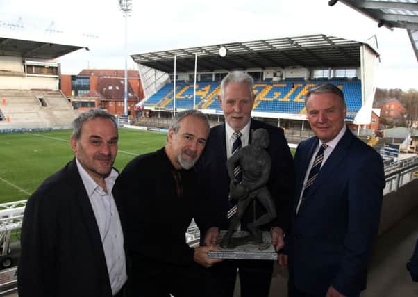 John Holmes' brother, Phil Holmes, shows off the maquette of John, which is the basis for a full size statue at the new South Stand. Pictured, left to right, Phil Caplan, sculptor Steve Winterburn, Phil Holmes and Gary Hetherington.