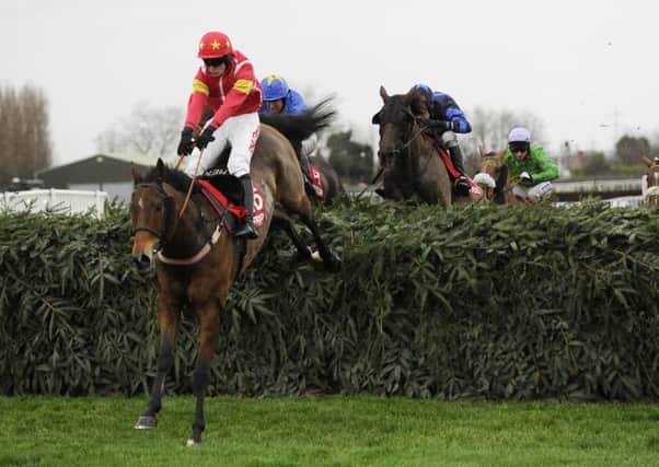 Henry Brooke and Highland Lodge clear the final fence in the 2015 Becher Chase.