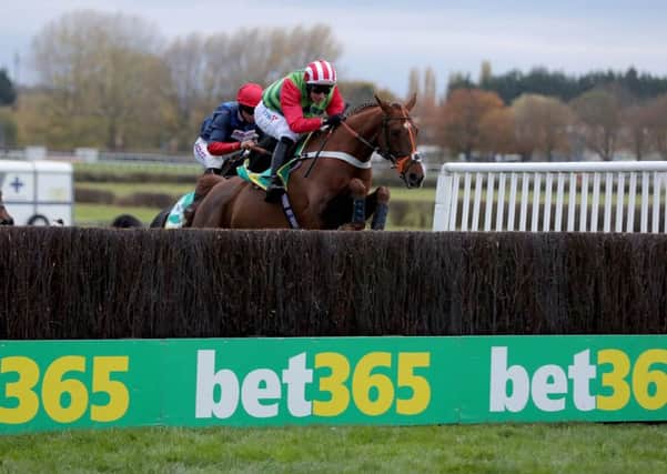 Charlie Hall Chase winner Definitly red is due to carry a six pound penalty at Aintree today.