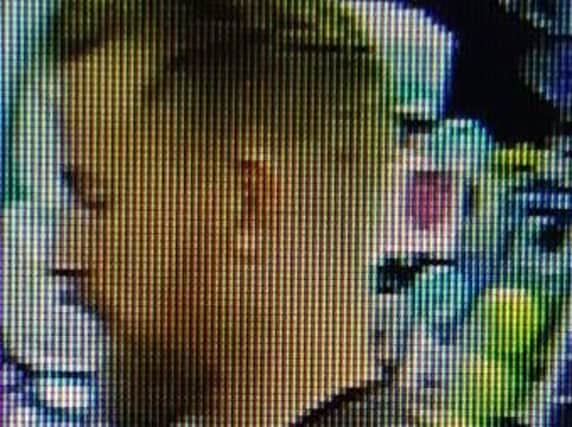 Police want to speak to this man about  the handbag theft