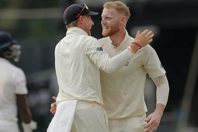 England's Ben Stokes, right, is congratulated by Joe Root for taking the wicket of Sri Lanka's Angelo Mathews during the third day of the third test cricket match between Sri Lanka and England in Colombo. Picture: AP/Eranga Jayawardena
