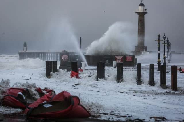 A dramatic photo of a tidal surge in Whitby.