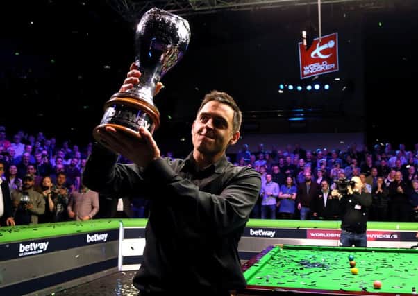 Ronnie O'Sullivan with the trophy after winning the Betway UK Championship at the York Barbican.