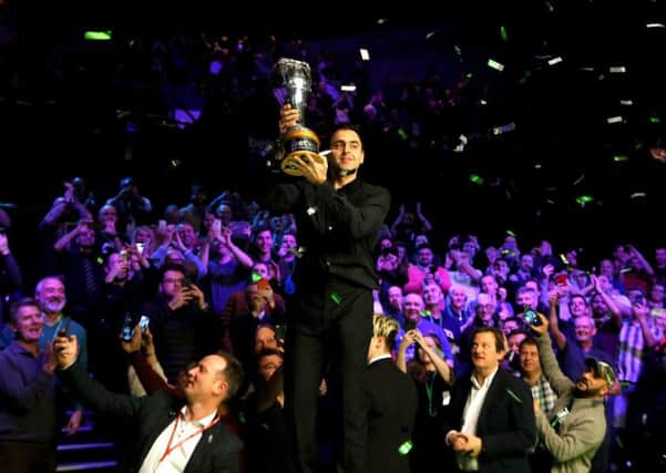 Ronnie O'Sullivan with the trophy after winning the Betway UK Championship at The York Barbican.