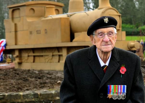 TRIBUTE: Former cavalryman David Evans, top, at the stone sculpture of a railway engine he unveiled at Catterick Garrison.