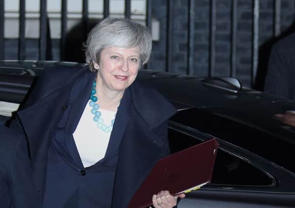 Prime Minister Theresa May arrives back at 10 Downing Street. Should she be replaced?