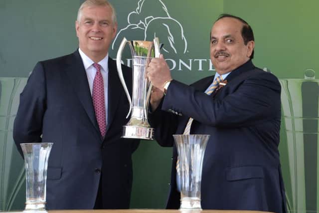 The Duke of York presents the trophy to the owner of Postponed, Sheikh Mohammed Obaid Al Maktoum, after winning the Juddmonte International Stakes during day one of the 2016 Yorkshire Ebor Festival at York (Picture: PA)