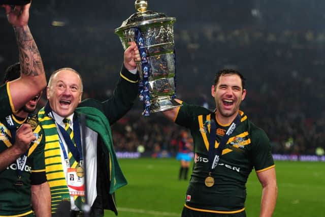 Then Australia coach Tim Sheens and Cameron Smith celebrate victory in the 2013 Rugby League World Cup Final at Old Trafford (Picture: Anna Gowthorpe/PA Wire).