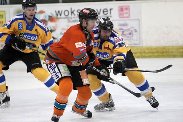 Ben Simon, left, battles for possession with fellow player-coach, Hull Stingrays' Sylvain Cloutier back in 2011. Picture courtesy of Arthur Foster