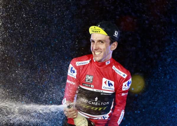 Mitchelton-Scott's British cyclist Simon Yates celebrates on the podium after winning the 73rd edition of "La Vuelta" Tour of Spain cycling race in Madrid on September 16, 2018. (Picture: BENJAMIN CREMEL/AFP/Getty Images)