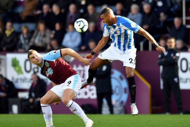 Huddersfield Town's Mathias Zanka Jorgensen (right) and Burnley's Sam Vokes during the Premier League game (Picture: PA)