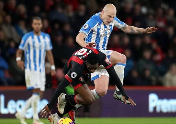 Huddersfield Town's Aaron Mooy in action against Bournemouth. The Australian has been ruled out until February (Picture: PA)