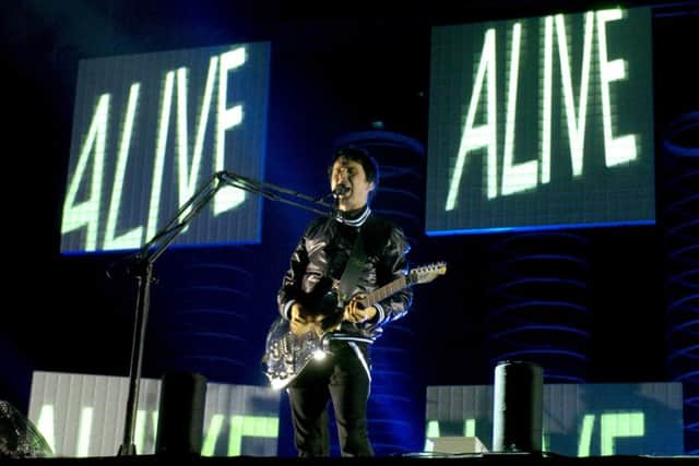 Muse perform on stage at Leeds Festival back in 2006.