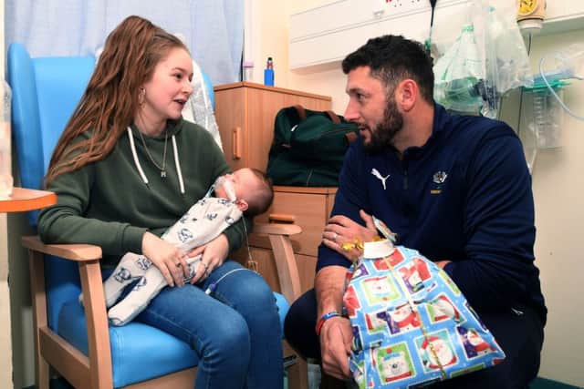 Yorkshire County Cricket's Tim Bresnan chats to Mataya Adams with her baby Jaylen Williams, during the club's visit to the LGI.
 (Picture: Jonathan Gawthorpe)
