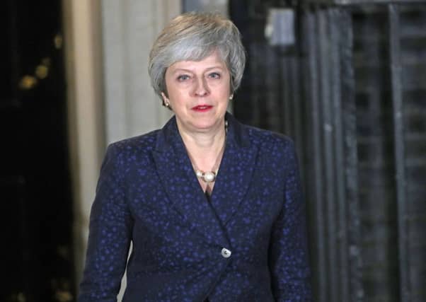 A crestfallen Theresa May addresses the nation after surviving a confidence vote - for now