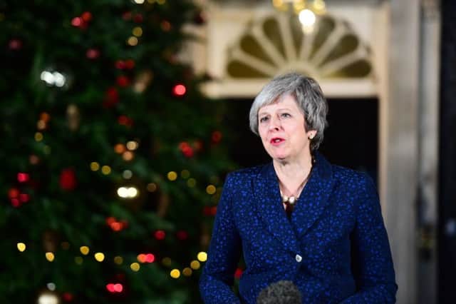 Theresa May makes a statement in Downing Street, after she survived an attempt by Tory MPs to oust her with a vote of no confidence.