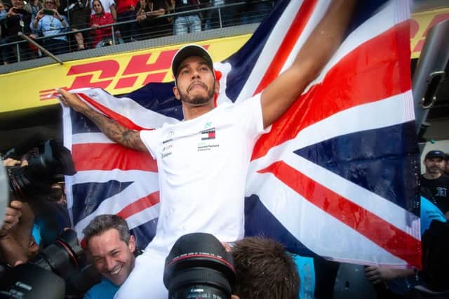 On top of the world: Mercedes' Lewis Hamilton.
