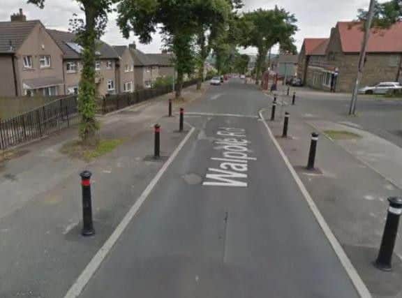 The man was shot in Walpole Road, Huddersfield