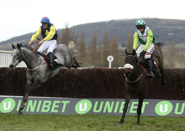 Guitar Pete (left) ridden by Ryan Day jumps the last to win the 2017 Caspian Caviar Gold Cup from Clan Des Obeaux.