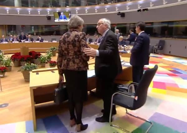 Theresa May and Jean-Claude Juncker exchange sharp words at the EU summit.