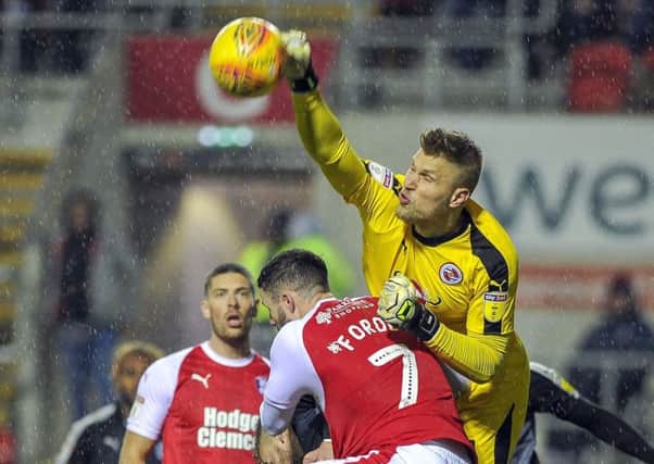 Up in the air: Rotherham Uniteds Anthony Forde challenges Reading goalkeeper Anssi Jaakkola for one of the many set-pieces the Millers pumped into the Royals box on Saturday (Picture: Scott Merrylees)