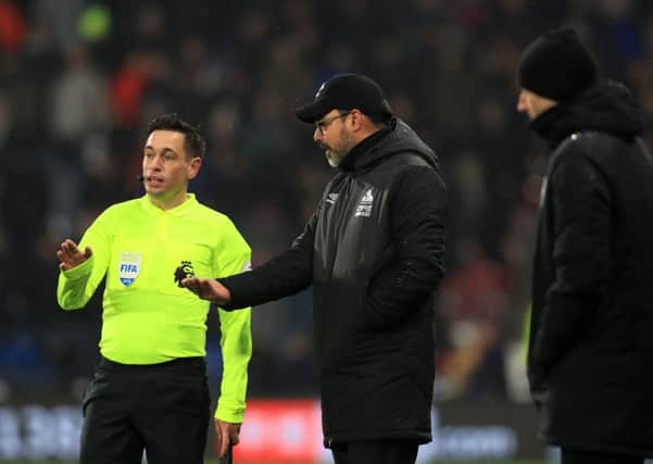 Huddersfield Town head coach David Wagner talks to referee Anthony Taylor during their Premier League home defeat to Newcastle United (Picture: Mike Egerton/PA Wire).