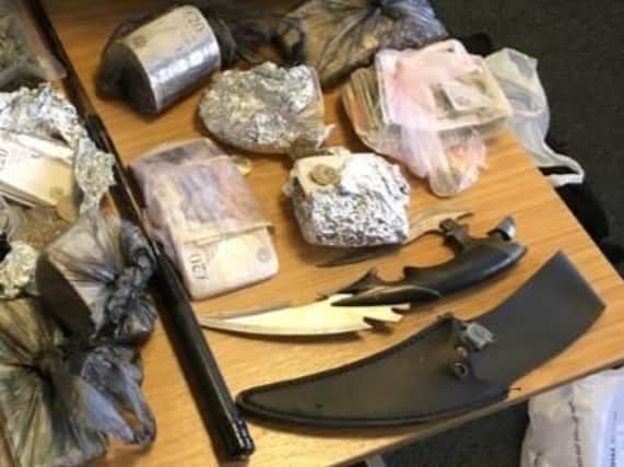 Cash, zombie knives and an extendable baton were found by police when they raided a property in Bridlington.