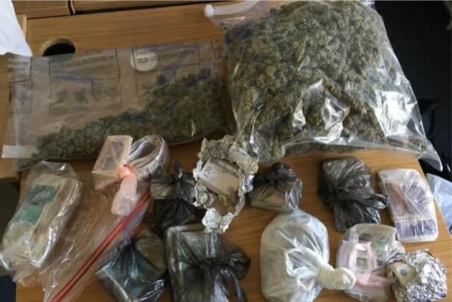 Cash and cannabis recovered by officers during the execution of the warrant.