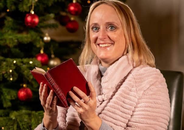 Lucinda Hawksley, holding a copy of the classic,  A Christmas Carol, signed by Charles Dickens in 1844. Picture: Charlotte Graham